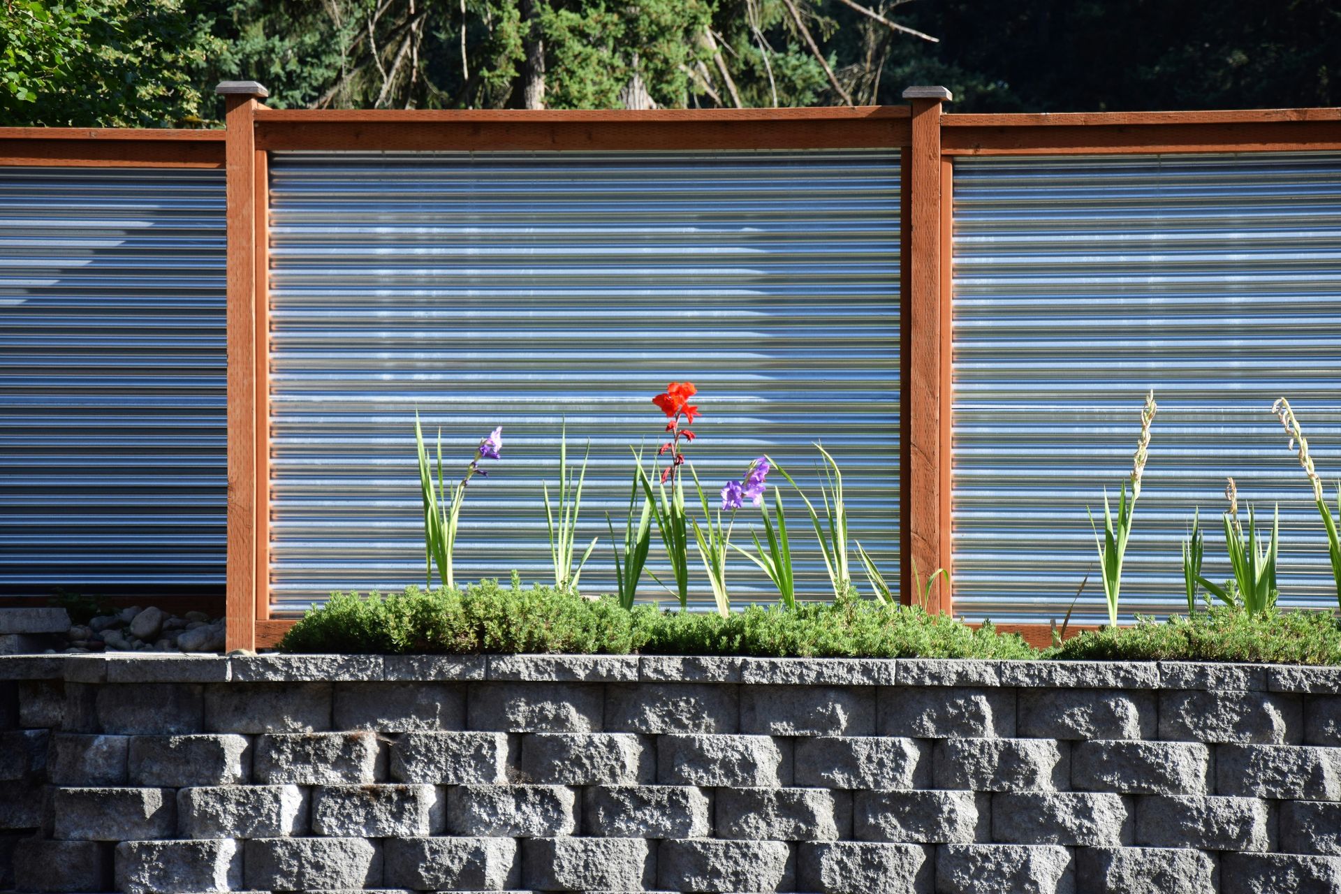 a brick wall with a flower in front of it